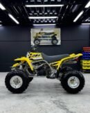 ⚙️ Specifications Engine: 347cc, twin-cylinder, 2-stroke Transmission: 6-speed manual Drive: Chain-driven (2WD) Cooling: Liquid-cooled Fuel system: Carbureted 🚀 Performance Explosive acceleration and high top speed Extremely lightweight and agile Built for racing, dunes, and hard off-road riding Very responsive throttle (high-adrenaline ride) 🔥 Highlights One of the fastest 2-stroke quads ever made Huge aftermarket support for tuning & upgrades Classic aggressive Yamaha sound Still highly demanded even after production ended