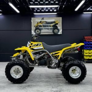 ⚙️ Specifications Engine: 347cc, twin-cylinder, 2-stroke Transmission: 6-speed manual Drive: Chain-driven (2WD) Cooling: Liquid-cooled Fuel system: Carbureted 🚀 Performance Explosive acceleration and high top speed Extremely lightweight and agile Built for racing, dunes, and hard off-road riding Very responsive throttle (high-adrenaline ride) 🔥 Highlights One of the fastest 2-stroke quads ever made Huge aftermarket support for tuning & upgrades Classic aggressive Yamaha sound Still highly demanded even after production ended