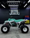 ⚙️ Key Specifications Engine: 347cc, twin-cylinder, 2-stroke Transmission: 6-speed manual Drive: Chain-driven rear wheel (2WD) Cooling: Liquid-cooled system Fuel system: Dual carburetors 🚀 Performance Extremely fast acceleration for its era Lightweight chassis for sharp handling Strong power delivery (aggressive 2-stroke feel) Built for sand dunes, trails, and racing use 🔥 Highlights Classic early-production Banshee model Highly collectible and sought after today Easy to modify with huge aftermarket support Famous loud “2-stroke twin” sound