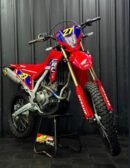 The 2023 Honda CRF250L is widely regarded as a "super smooth," reliable, and forgiving dual-sport motorcycle, ideal for both commuting and light off-road trail riding. While some riders note that the stock suspension feels soft or spongy, this contributes to a comfortable ride on rough terrain, avoiding harsh shocks to the rider
