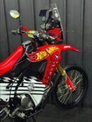 2018 Honda CRF 250 Rally "full mod" adventure build, focus on addressing the bike's stock limitations: soft suspension, modest power, and limited fuel range. Essential Performance Upgrades Suspension: This is the most critical mod. Replacing the rear shock with a YSS or Ohlins unit and installing front fork cartridges or Race Tech gold valves significantly improves stability and prevents the "nose-diving" common on stock bikes. Engine & Exhaust: To gain a bit more pep, popular mods include a Yoshimura or FMF exhaust paired with an electronic fueling kit like the EJK (Electronic Jet Kit) and air box modifications. Protection: Enhance durability with a heavy-duty bash plate (e.g., R&G), Barkbusters handguards, and crankcase protectors to safeguard against drops on rocky trails.