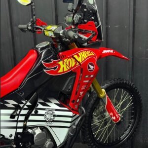 2018 Honda CRF 250 Rally "full mod" adventure build, focus on addressing the bike's stock limitations: soft suspension, modest power, and limited fuel range. Essential Performance Upgrades Suspension: This is the most critical mod. Replacing the rear shock with a YSS or Ohlins unit and installing front fork cartridges or Race Tech gold valves significantly improves stability and prevents the "nose-diving" common on stock bikes. Engine & Exhaust: To gain a bit more pep, popular mods include a Yoshimura or FMF exhaust paired with an electronic fueling kit like the EJK (Electronic Jet Kit) and air box modifications. Protection: Enhance durability with a heavy-duty bash plate (e.g., R&G), Barkbusters handguards, and crankcase protectors to safeguard against drops on rocky trails.